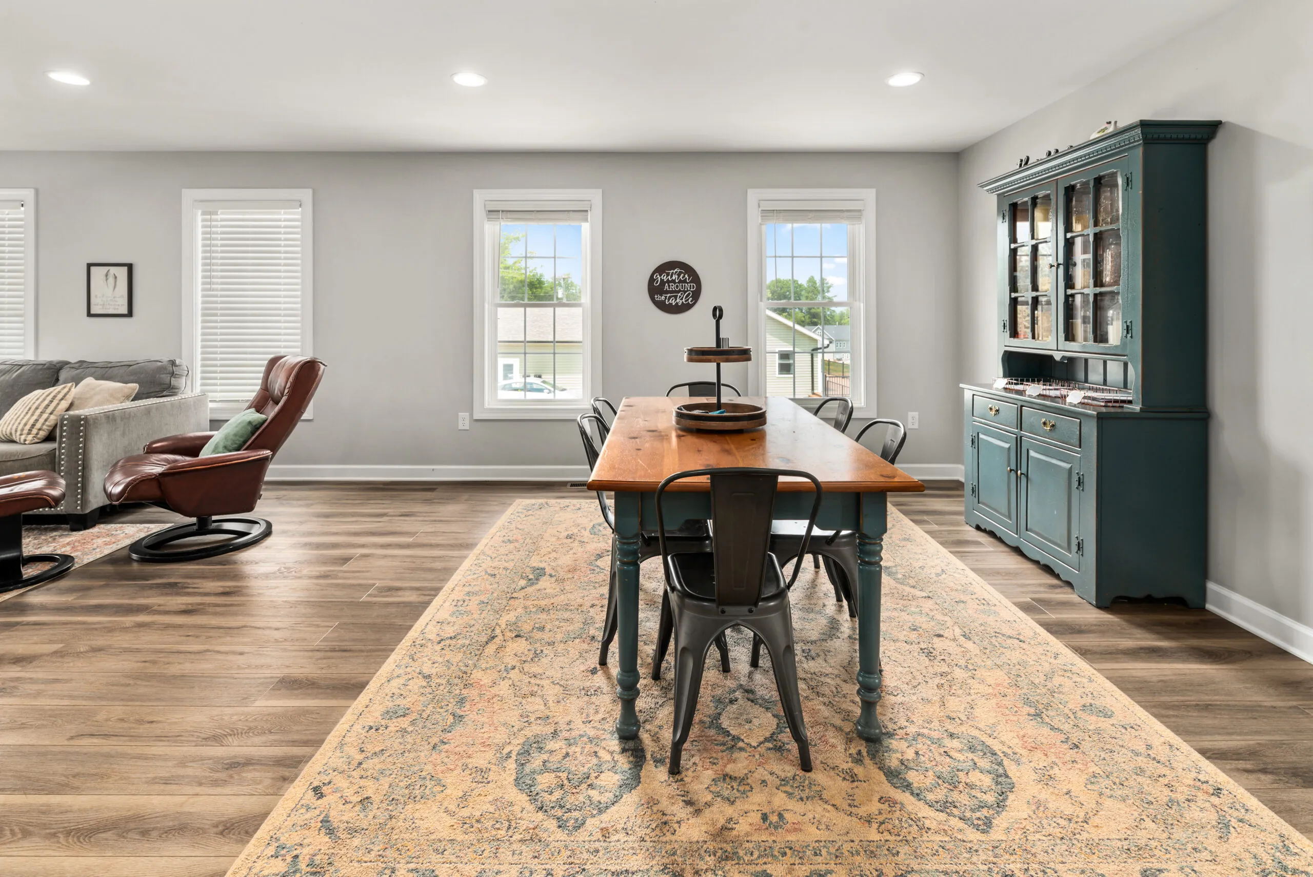 Dining area and living room seen from the side in the Timber Ridge Home