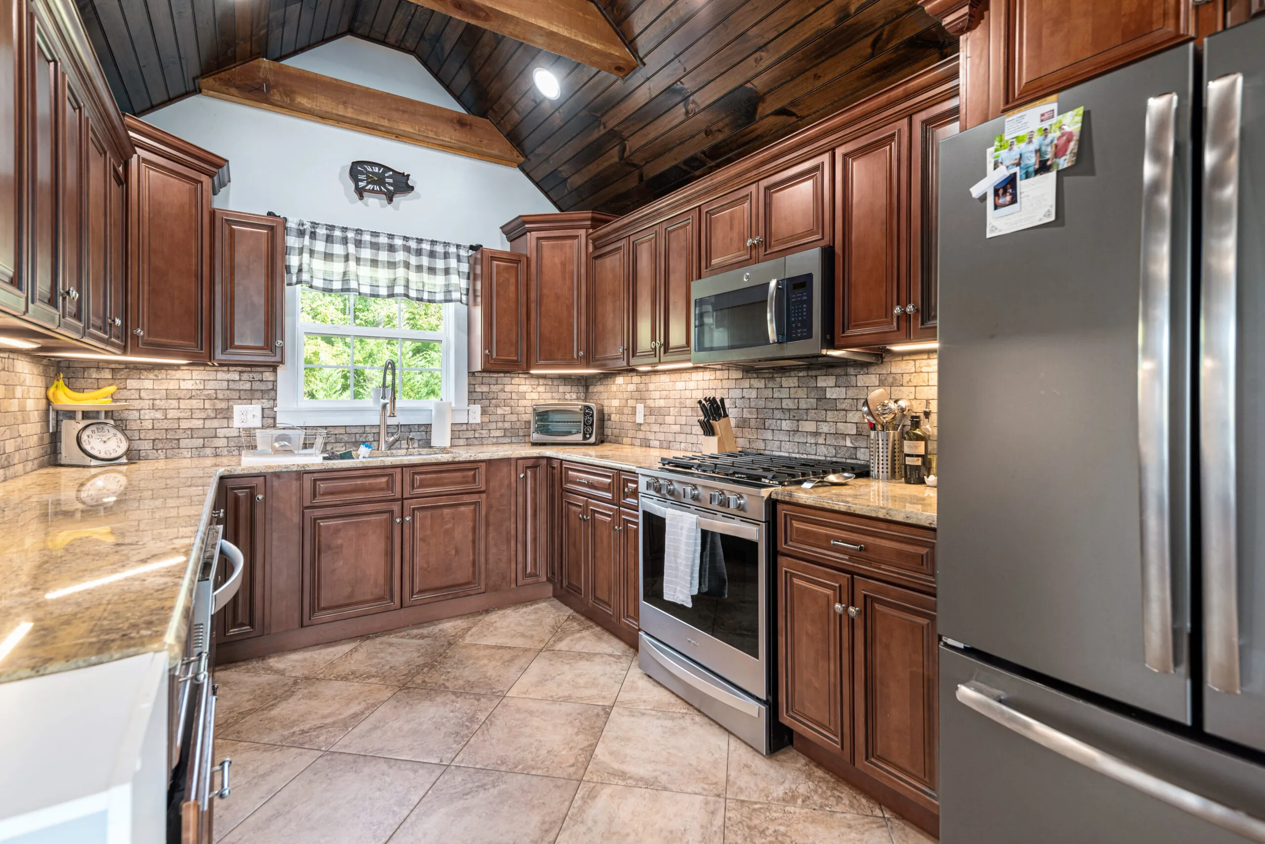 Kitchen with cherry cabinets, granite counters and stainless appliances in the Lowry Home