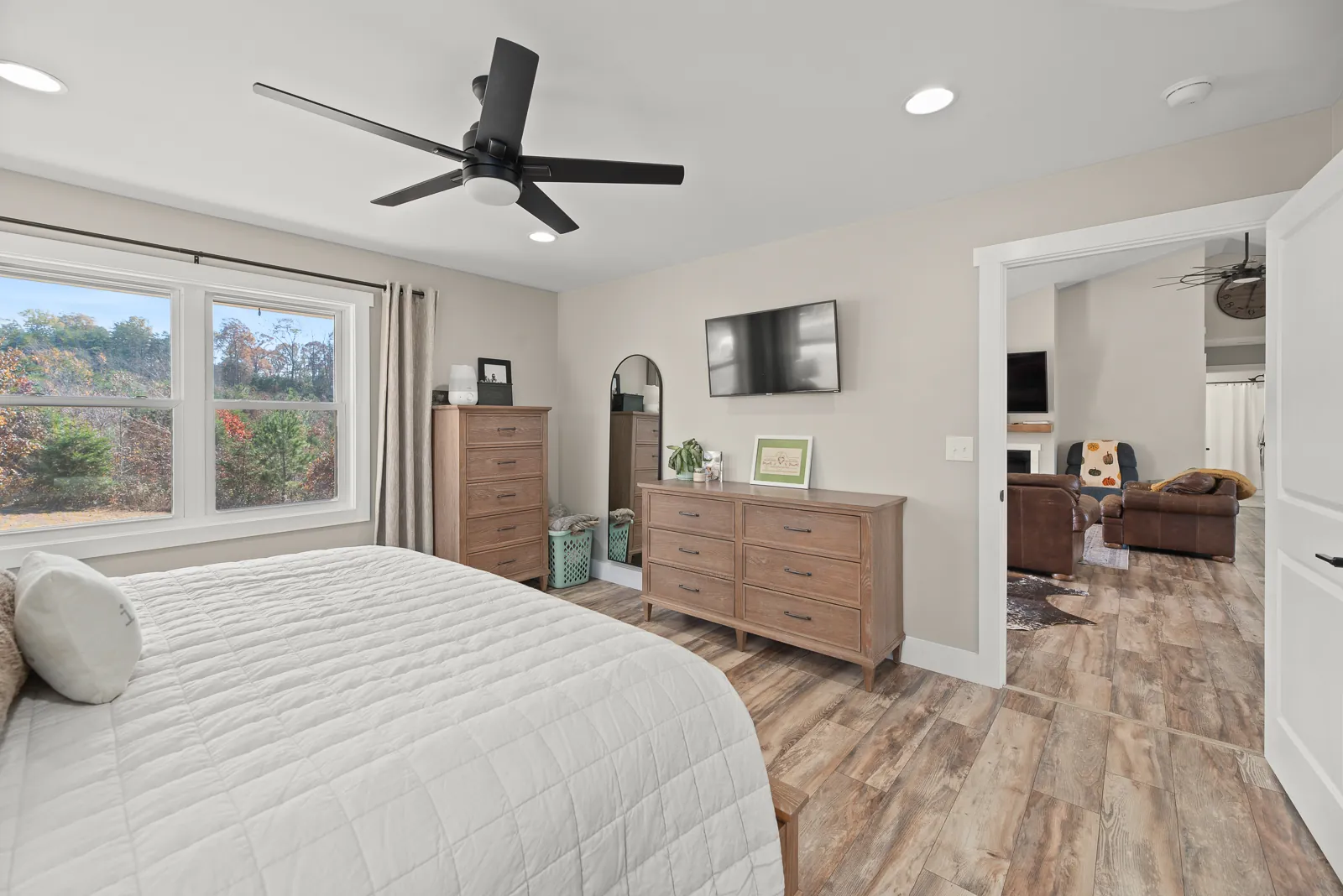 Primary bedroom with doorway to the living room in the Carter's Mill Home