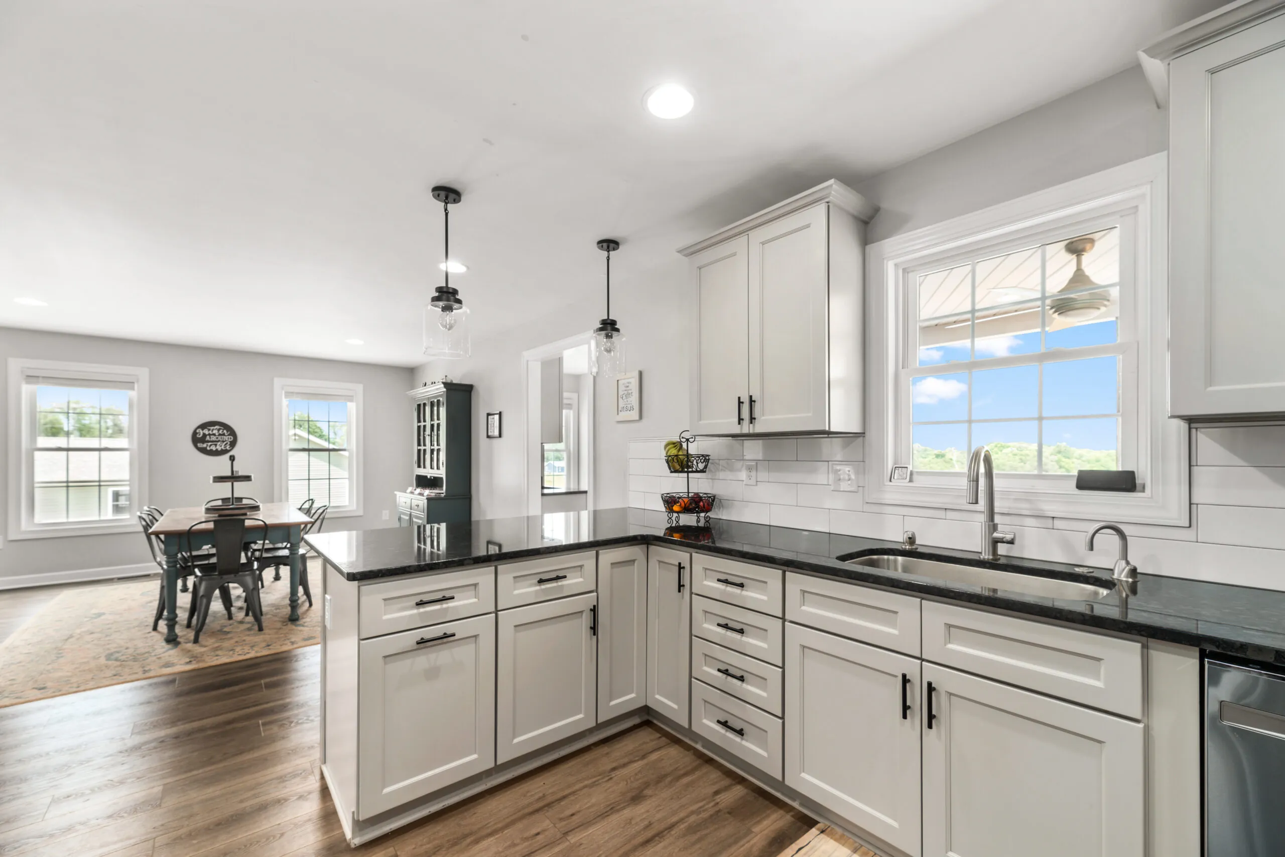 Kitchen peninsula bar looking toward the dining area in the Timber Ridge Home