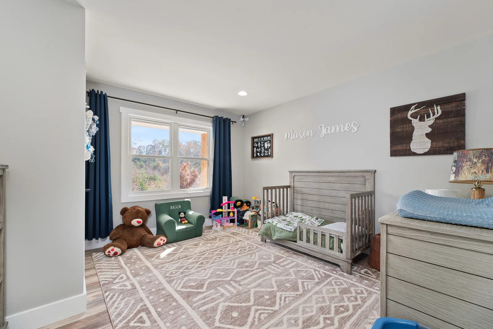 Boy's bedroom with toddler bed and deer art in the Carter's Mill Home