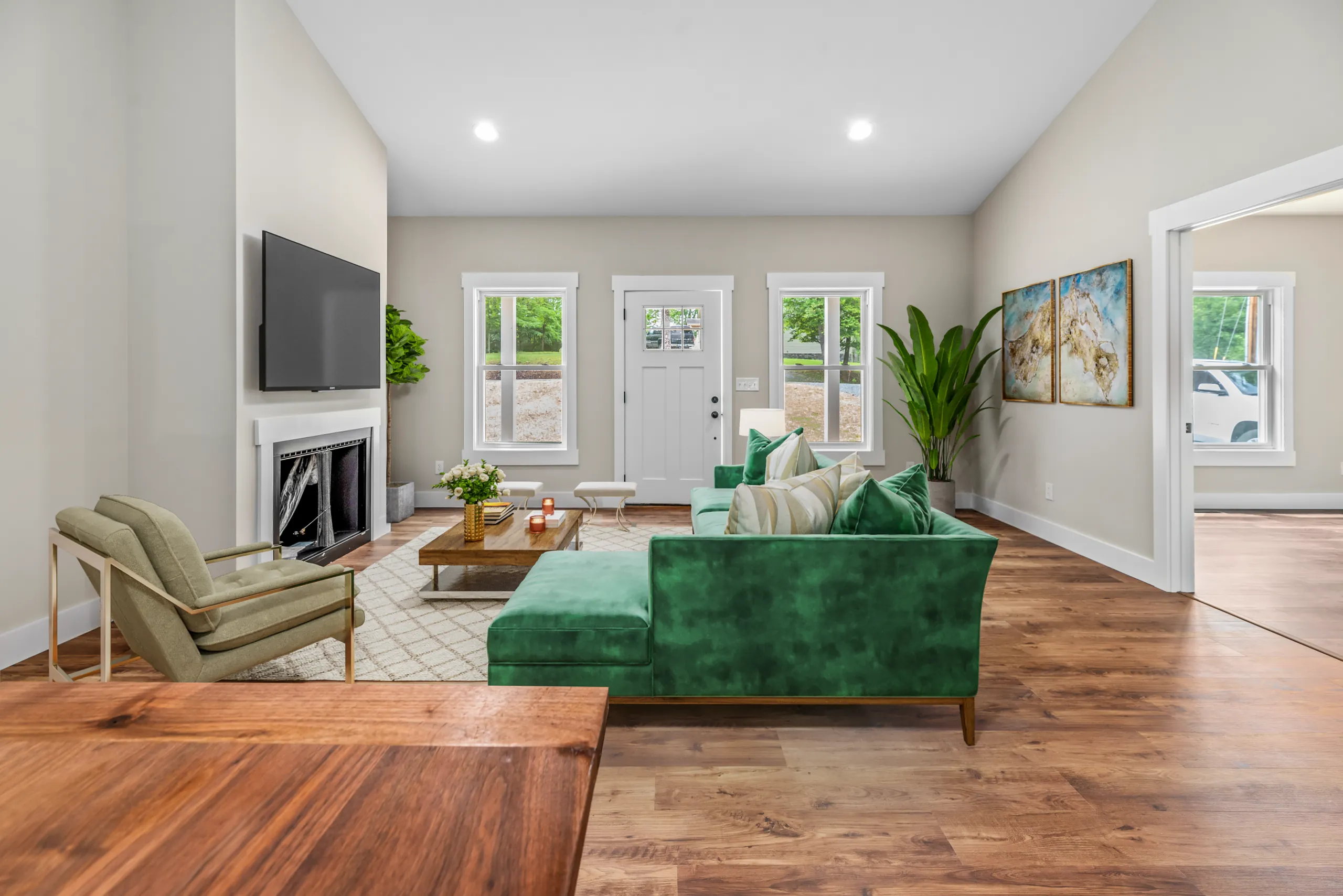 Living room with fireplace and front door in the Lake Crest Home