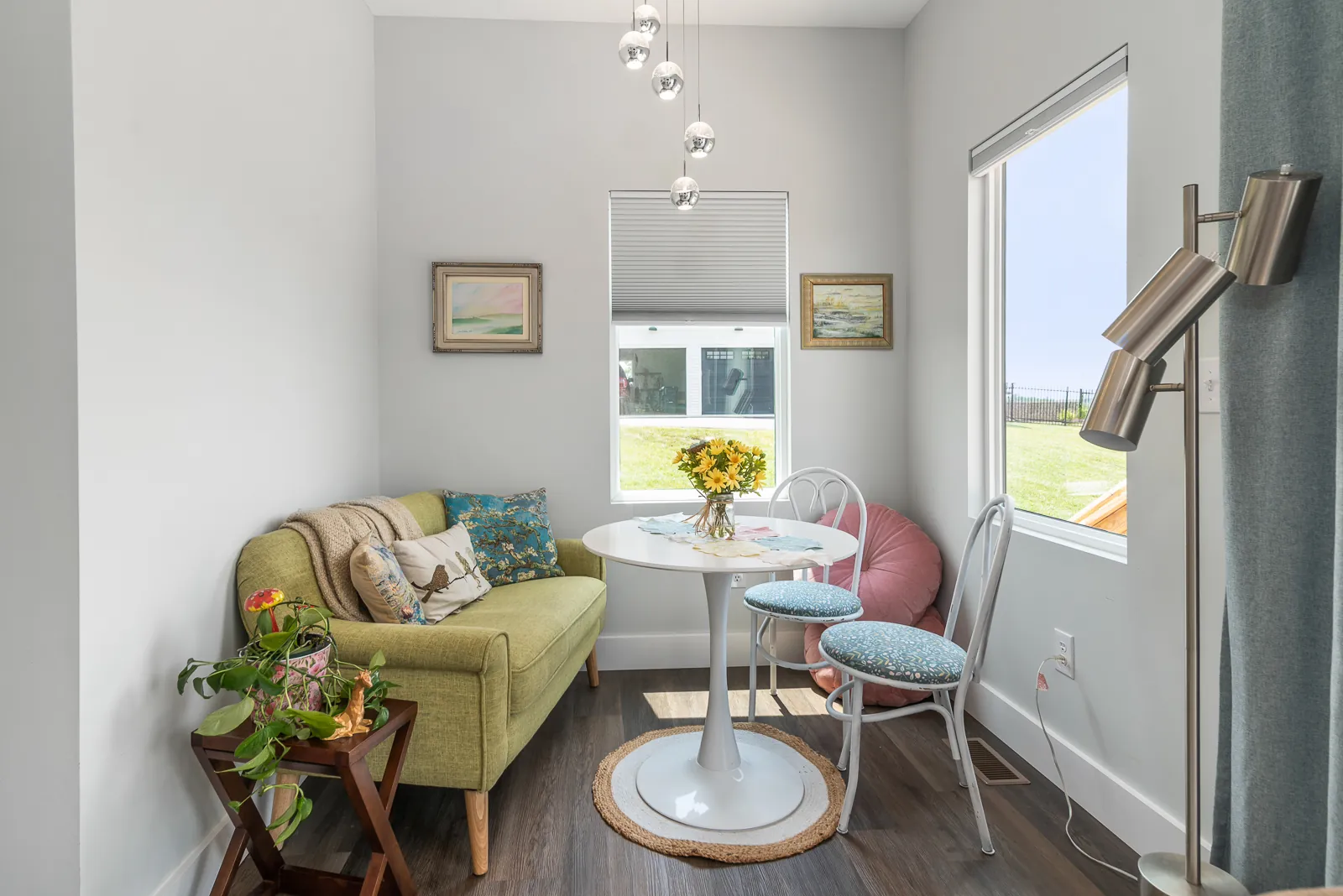 Bright breakfast nook with small table and window views in the LynBrook Home