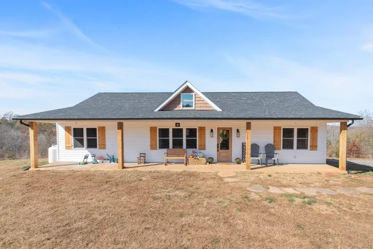 Front of the Carter's Mill Home with covered porch and wood shutters
