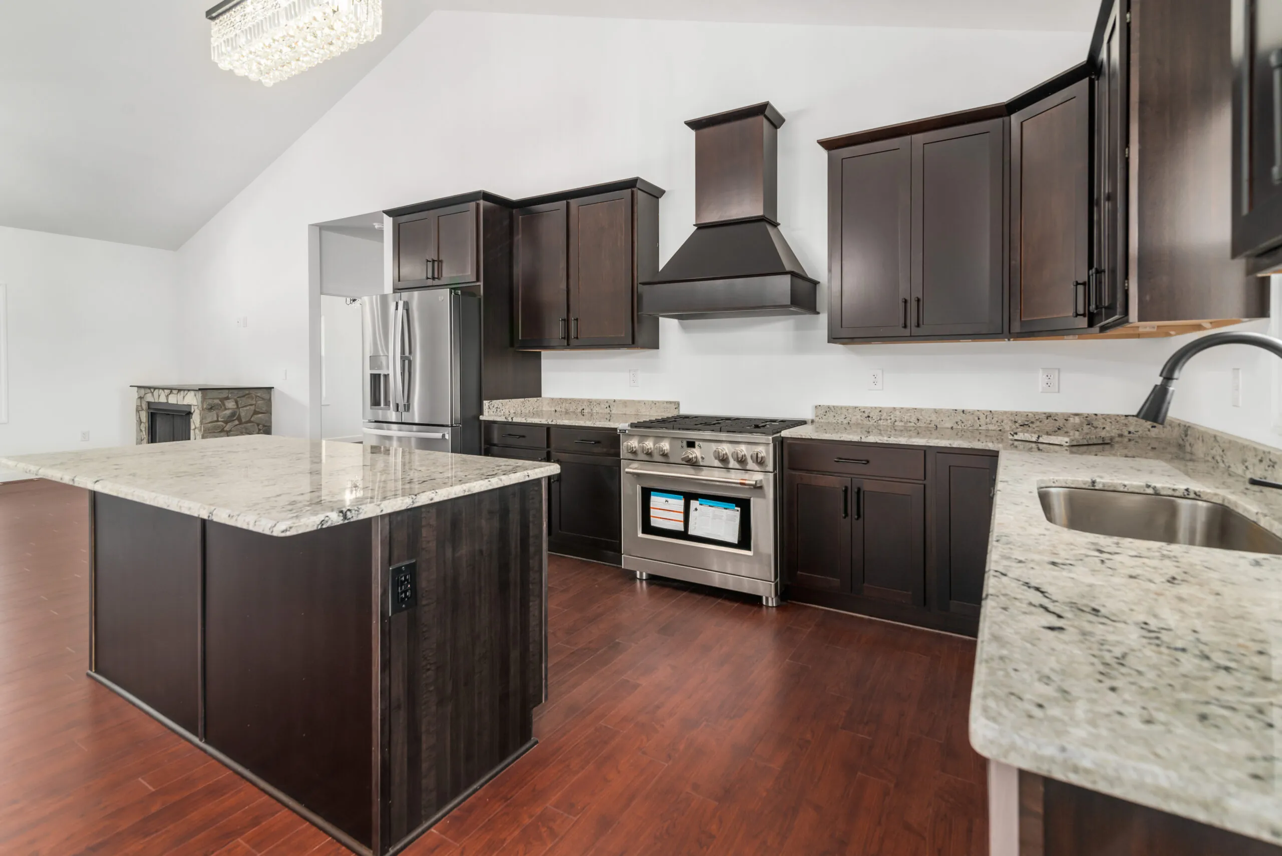 Kitchen island, granite counters and vaulted ceiling in the Otterlea Home