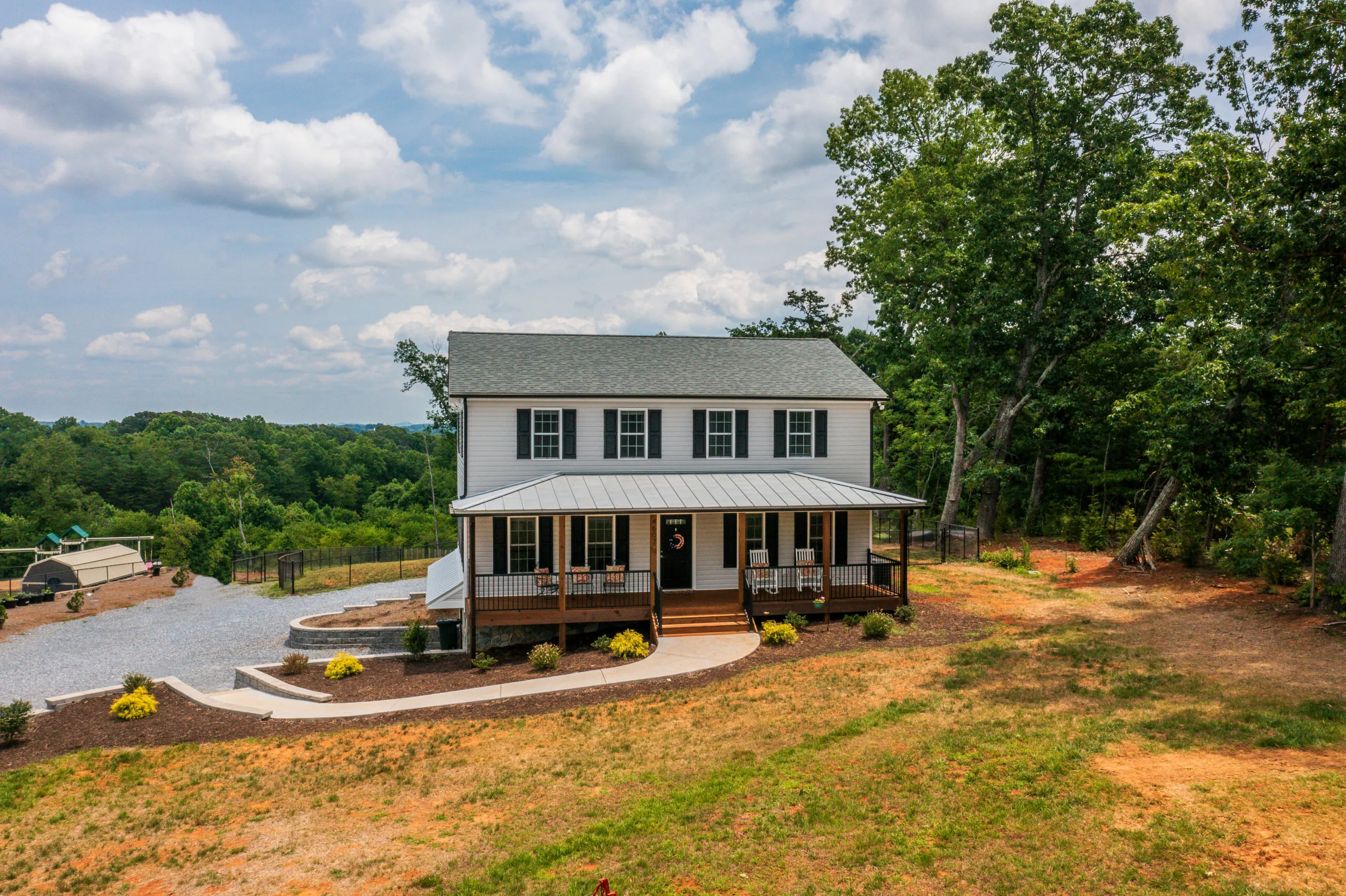 Front of the Timber Ridge Home with covered porch and metal porch roof