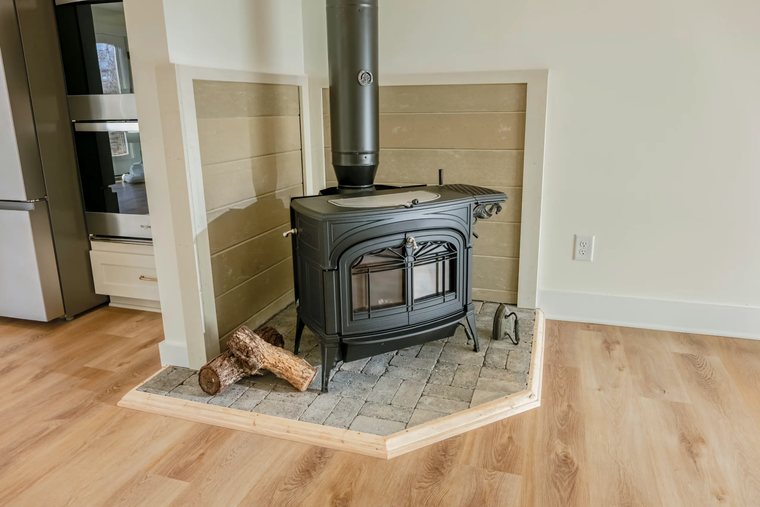 Cast iron wood stove on a stone hearth in the Meaders Mill Home
