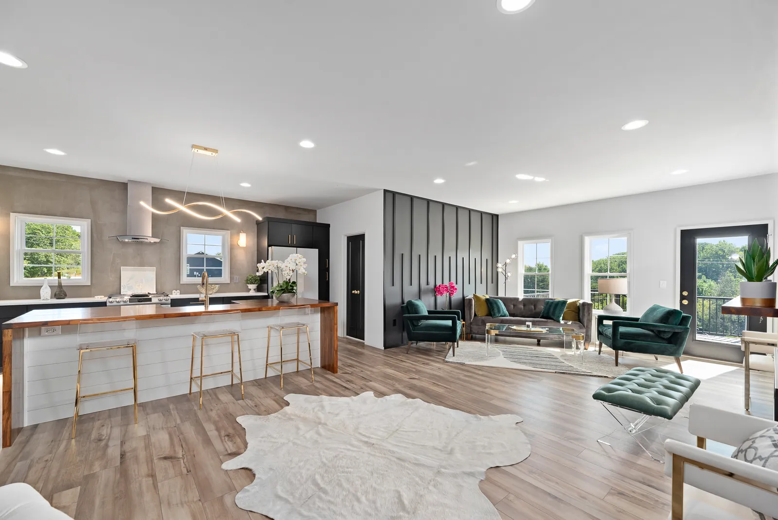 Open kitchen and living area with walnut bar in the Otter River Home
