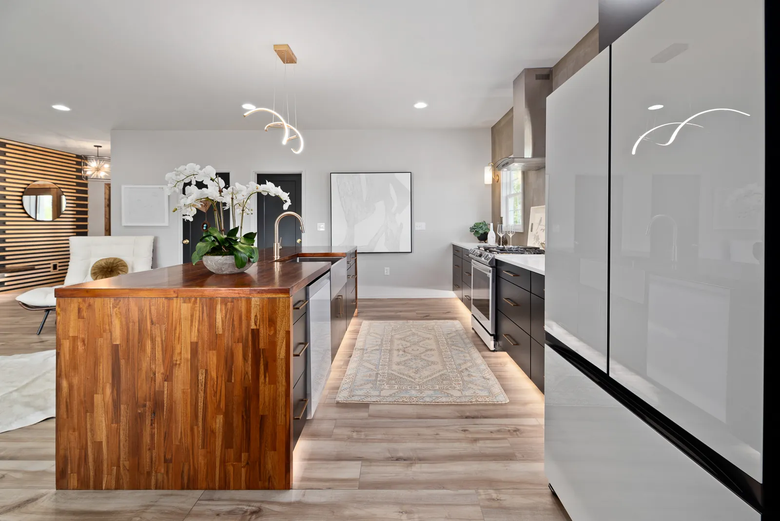 Kitchen island with walnut waterfall edge in the Otter River Home
