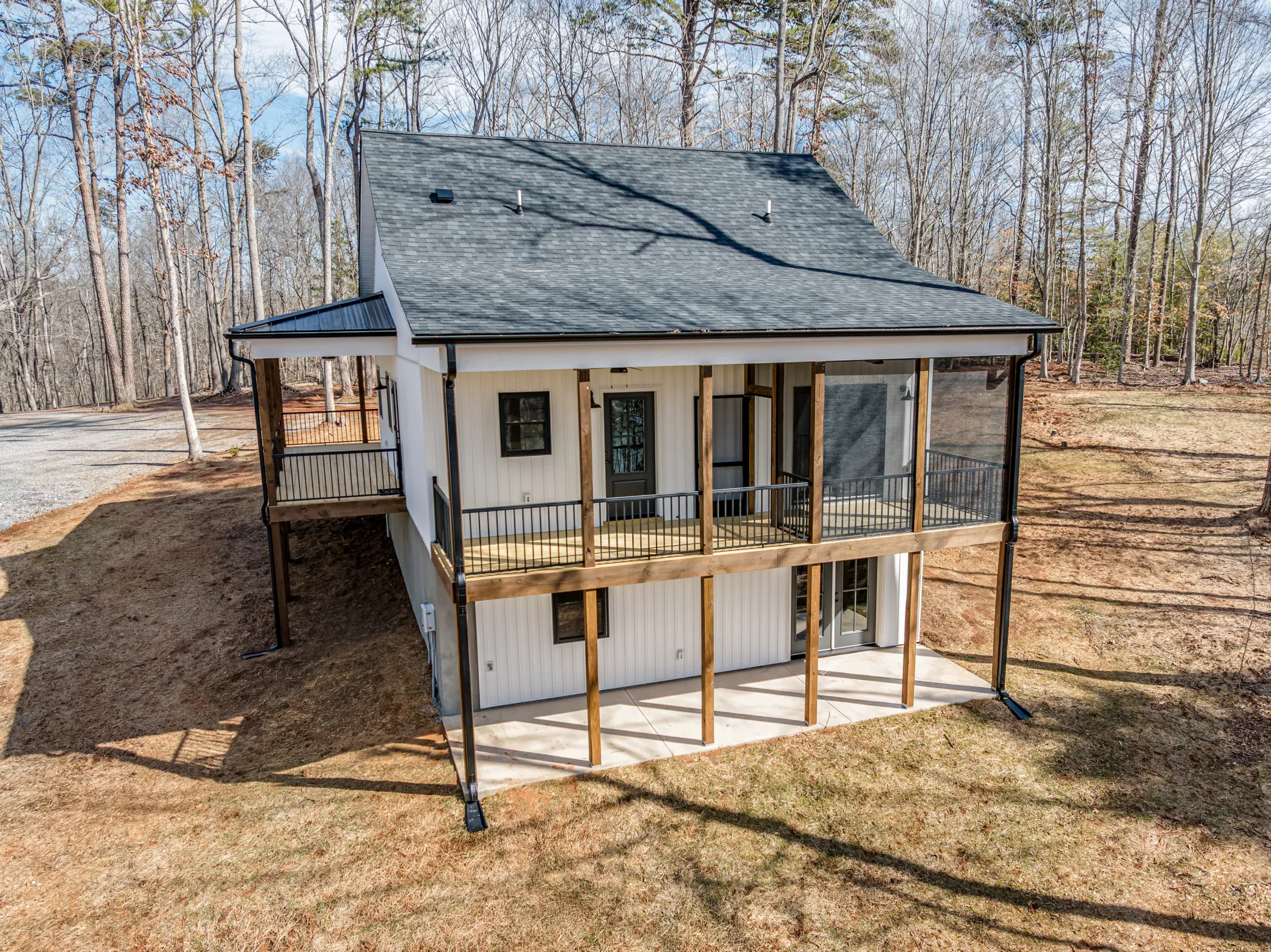 Rear of the Reservoir Home with deck, timber posts and concrete patio