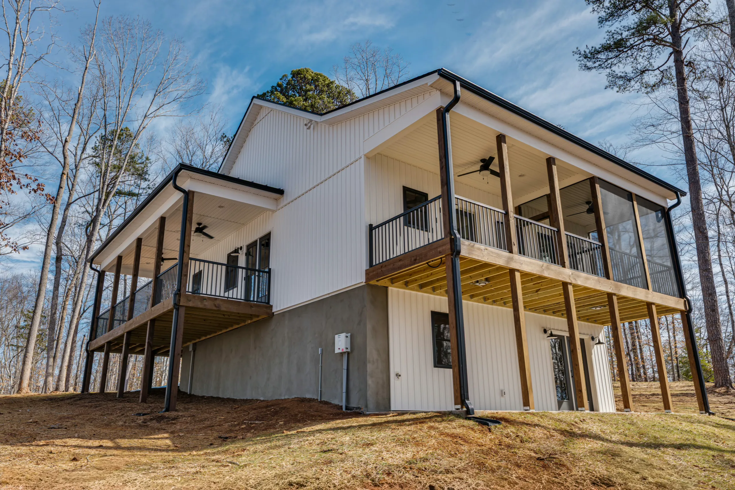Rear angled view of the Reservoir Home with screened porch and covered deck