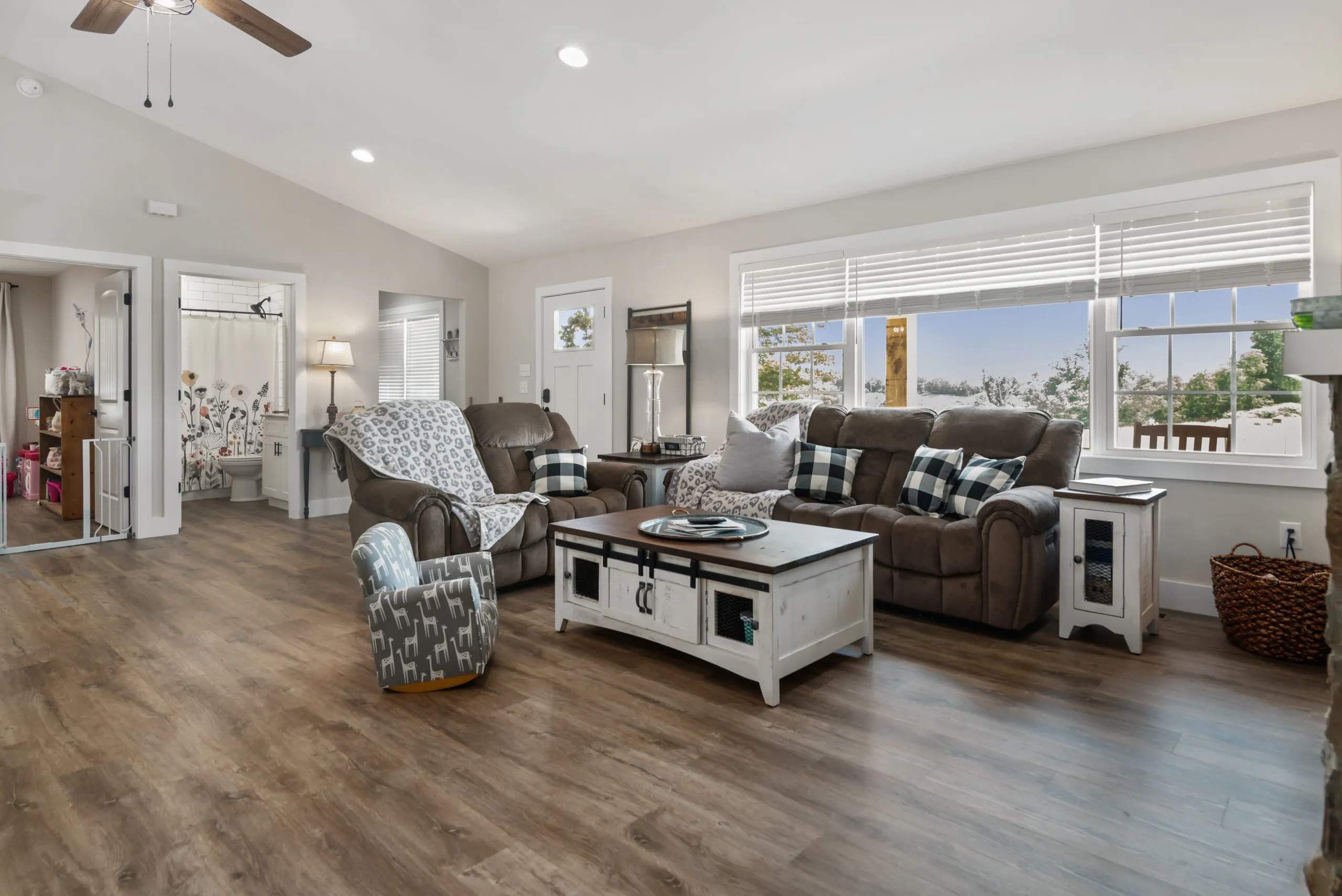 Vaulted living room with large windows in the Lake Cross Home