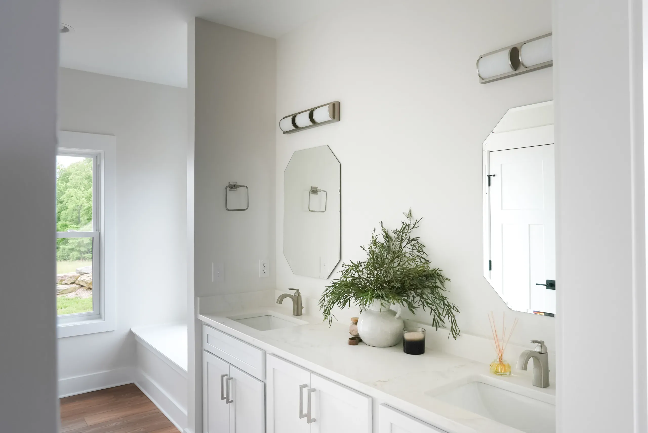 Double-sink vanity in the primary bathroom of the Mountain Crest Home